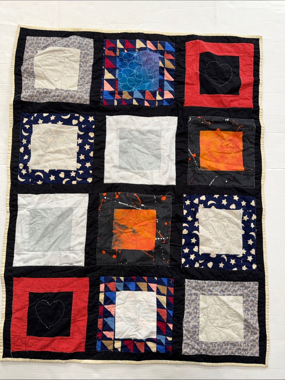 Patchwork Small Block Quilted Throw in Navy, Black, Red, Orange, Cream